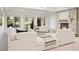 Bright living room with stone fireplace, and french doors providing natural light at 9171 E Harvard Ave, Denver, CO 80231