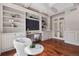 Well-appointed office with custom built-ins, hardwood floors, and french doors offering natural light at 9171 E Harvard Ave, Denver, CO 80231