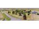 Aerial view of home and grounds surrounded by mature trees at 97 S Coolidge St, Aurora, CO 80018