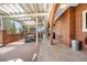 View of the home's beautiful brick-paved covered back patio, perfect for outdoor gatherings and relaxation at 97 S Coolidge St, Aurora, CO 80018