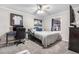 Cozy bedroom featuring a comfortable bed, desk area, and a window for natural light at 97 S Coolidge St, Aurora, CO 80018