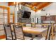 Open dining area with stylish lighting and seamless flow to living area and kitchen at 97 S Coolidge St, Aurora, CO 80018