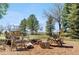 Outdoor fire pit area with seating and rustic charm, creating a cozy and inviting space for gatherings at 97 S Coolidge St, Aurora, CO 80018