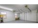 Spacious three-car garage featuring ample storage and workspace, perfect for car enthusiasts and hobbyists at 97 S Coolidge St, Aurora, CO 80018