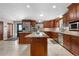 A gourmet kitchen featuring granite countertops, stainless steel appliances, and custom wood cabinetry at 97 S Coolidge St, Aurora, CO 80018