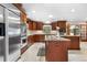 Gourmet kitchen with stainless steel appliances, custom cabinetry, and island at 97 S Coolidge St, Aurora, CO 80018