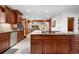 Spacious kitchen with stainless steel appliances, granite countertops, and adjoining breakfast nook at 97 S Coolidge St, Aurora, CO 80018
