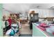 View into kitchen and living room with wood floors at 97 S Coolidge St, Aurora, CO 80018