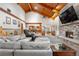 Spacious living room with vaulted wood ceilings and a cozy fireplace for a relaxing atmosphere at 97 S Coolidge St, Aurora, CO 80018