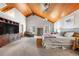 Spacious main bedroom featuring vaulted wood ceilings, carpet, and large windows for natural light at 97 S Coolidge St, Aurora, CO 80018