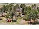 Aerial view of home and grounds with mature trees at 97 S Coolidge St, Aurora, CO 80018
