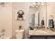 Stylish bathroom with shower, grey granite vanity, decorative pug wall art and gray accents at 6153 N Ceylon St # 303, Denver, CO 80249