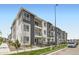 Attractive apartment building with a contemporary design, featuring balconies, and well-maintained landscaping at 6153 N Ceylon St # 303, Denver, CO 80249