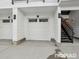 Attached one car garage with access to stairs for upper floors at 6153 N Ceylon St # 303, Denver, CO 80249