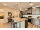 Stylish kitchen with a large island, stainless steel appliances, and modern countertops at 6153 N Ceylon St # 303, Denver, CO 80249