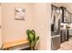 Open kitchen with stainless steel refrigerator, stainless steel appliances, and decorative items at 6153 N Ceylon St # 303, Denver, CO 80249