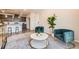 Comfortable living room offers cozy seating, soft carpet, and access to the kitchen at 6153 N Ceylon St # 303, Denver, CO 80249