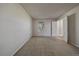 Bright bedroom with neutral carpet, window, and closet, offering a serene space for relaxation and personalization at 8329 W 90Th Pl, Westminster, CO 80021