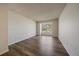 Bright bedroom featuring hardwood floors and a large window overlooking the yard at 8329 W 90Th Pl, Westminster, CO 80021