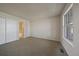 Cozy bedroom with plush carpet, a large window, and closet space, creating a comfortable private retreat at 8329 W 90Th Pl, Westminster, CO 80021