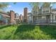 Charming townhomes featuring well-maintained lawns and classic brick chimneys offer a welcoming curb appeal at 8329 W 90Th Pl, Westminster, CO 80021
