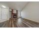 Spacious living room with stylish modern floors, cozy brick fireplace, and a bright window for natural light at 8329 W 90Th Pl, Westminster, CO 80021