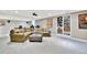 An expansive basement with a seating area and built-in shelves for optimal organization and entertainment at 5329 S Geneva St, Englewood, CO 80111