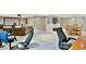 Basement with a projector screen, gaming chairs, and a table and chairs provides recreation space at 5329 S Geneva St, Englewood, CO 80111