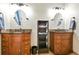 Elegant bathroom featuring dual sinks, a storage tower, and tiled flooring at 5329 S Geneva St, Englewood, CO 80111