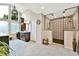 Luxurious bathroom featuring high ceilings, a modern shower, and a vanity with ample storage at 5329 S Geneva St, Englewood, CO 80111