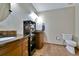 Elegant bathroom featuring dual sinks, a storage tower, and tiled flooring at 5329 S Geneva St, Englewood, CO 80111