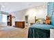 Cozy bedroom with a wood bed frame, dresser, and a window with natural light at 5329 S Geneva St, Englewood, CO 80111
