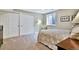 Bedroom features a bed, soft carpet, a window for natural light, and built-in closet for storage at 5329 S Geneva St, Englewood, CO 80111