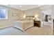 Cozy bedroom with neutral paint, soft carpet, a full-size bed and bedside tables with decorative lamps at 5329 S Geneva St, Englewood, CO 80111
