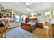 Comfortable bedroom featuring a wood bed frame, carpet flooring and natural light from the window at 5329 S Geneva St, Englewood, CO 80111