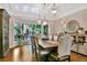 Bright dining room with a bay window, hardwood floors, and stylish furnishings at 5329 S Geneva St, Englewood, CO 80111