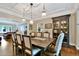 Elegant dining room featuring coffered ceilings, hardwood floors, and decorative lighting at 5329 S Geneva St, Englewood, CO 80111