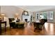 Comfortable living room featuring a fireplace, bay window, and hardwood floors at 5329 S Geneva St, Englewood, CO 80111