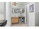 A sleek and modern bathroom with an undermount sink, bright lighting and framed vanity mirror at 2752 S Heather Gardens Way, Aurora, CO 80014