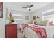 Comfortable bedroom featuring two twin beds, neutral walls, and a ceiling fan at 2752 S Heather Gardens Way, Aurora, CO 80014