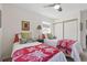 Comfortable bedroom featuring two twin beds, neutral walls, and a ceiling fan at 2752 S Heather Gardens Way, Aurora, CO 80014