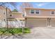 Inviting townhouse with a two-car garage and well-maintained front yard and a beautiful stone detail at 2752 S Heather Gardens Way, Aurora, CO 80014