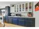 This well-appointed kitchen features mixed color cabinets and display shelves, plus stainless appliances at 2752 S Heather Gardens Way, Aurora, CO 80014
