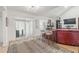 Bright living room with sliding glass doors, modern furnishings, and a cozy fireplace adding warmth to the space at 2752 S Heather Gardens Way, Aurora, CO 80014