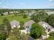 Aerial view of residential houses near lake showcasing its serene surroundings at 7400 W Grant Ranch Blvd # 19, Littleton, CO 80123