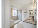 Modern bathroom featuring a walk-in shower with a glass door and seat at 7400 W Grant Ranch Blvd # 19, Littleton, CO 80123