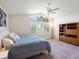 Bright bedroom with vaulted ceiling, large window with shutters, and a ceiling fan at 7400 W Grant Ranch Blvd # 19, Littleton, CO 80123