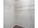Walk-in closet with built-in wire shelving for organizing clothes and accessories at 7400 W Grant Ranch Blvd # 19, Littleton, CO 80123