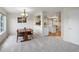 Open concept dining room shows view into kitchen with white cabinets and granite countertops at 7400 W Grant Ranch Blvd # 19, Littleton, CO 80123