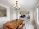 Open concept dining room view into Gathering room with fireplace and plenty of natural light at 7400 W Grant Ranch Blvd # 19, Littleton, CO 80123